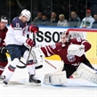 MINSK, BELARUS - MAY 15: USA's Craig Smith #15 with a scoring chance against Latvia's Kristers Gudlevskis #50 while Jekabs Redlihs #14 looks on during preliminary round action at the 2014 IIHF Ice Hockey World Championship. (Photo by Andre Ringuette/HHOF-IIHF Images)